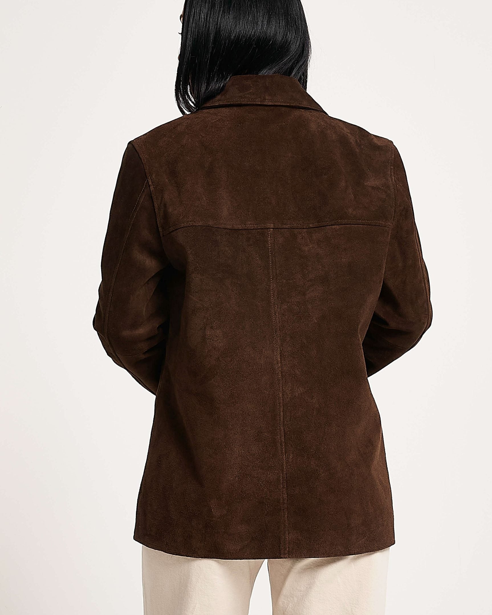 Brown suede jacket worn by a person on a white background