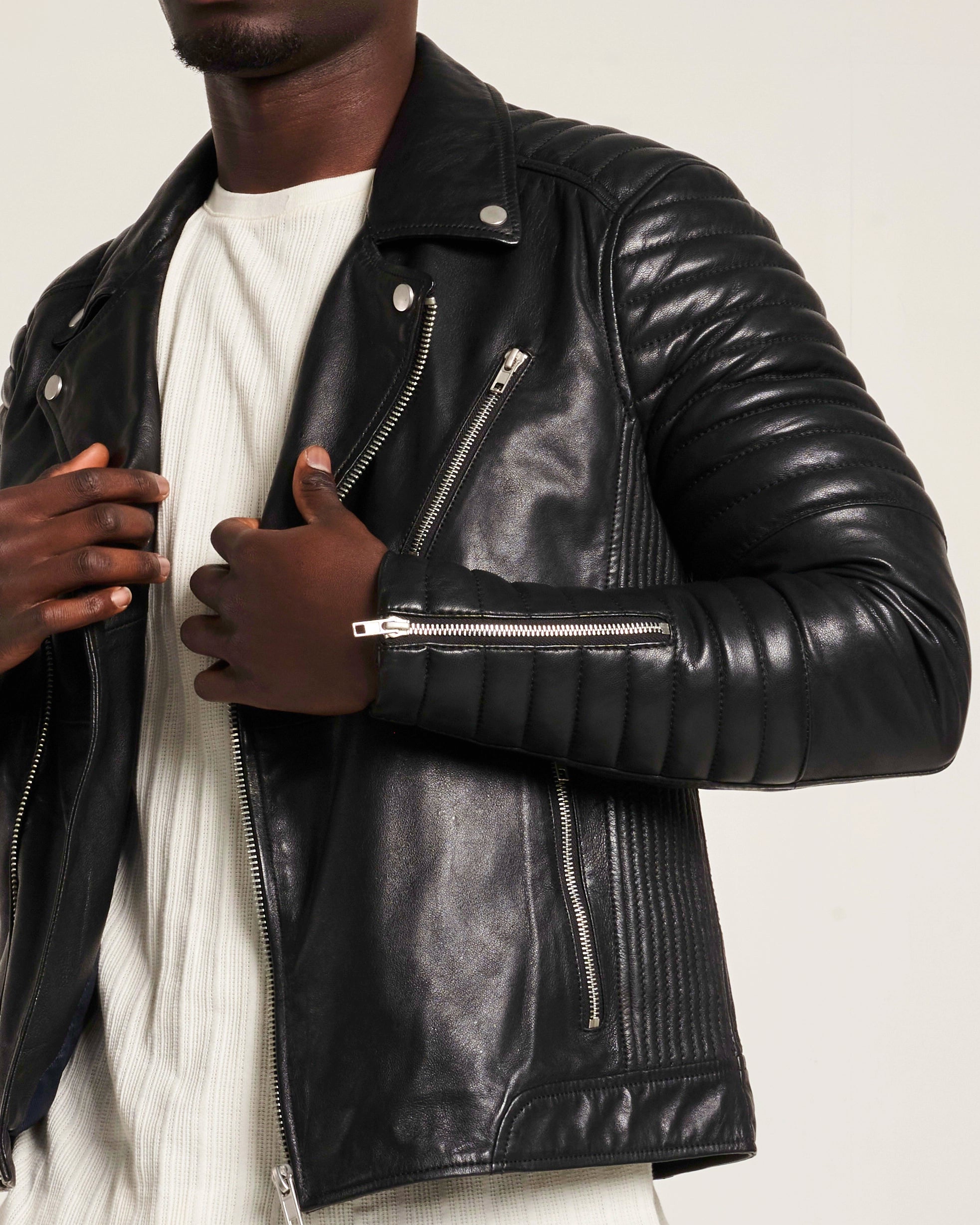Close up detail how of ribbed sleeve detailing on real leather jacket by Barneys Originals. The ribbed detail runs from the shoulder and across the bicep. It ends before the elbow and starts again around the cuff.