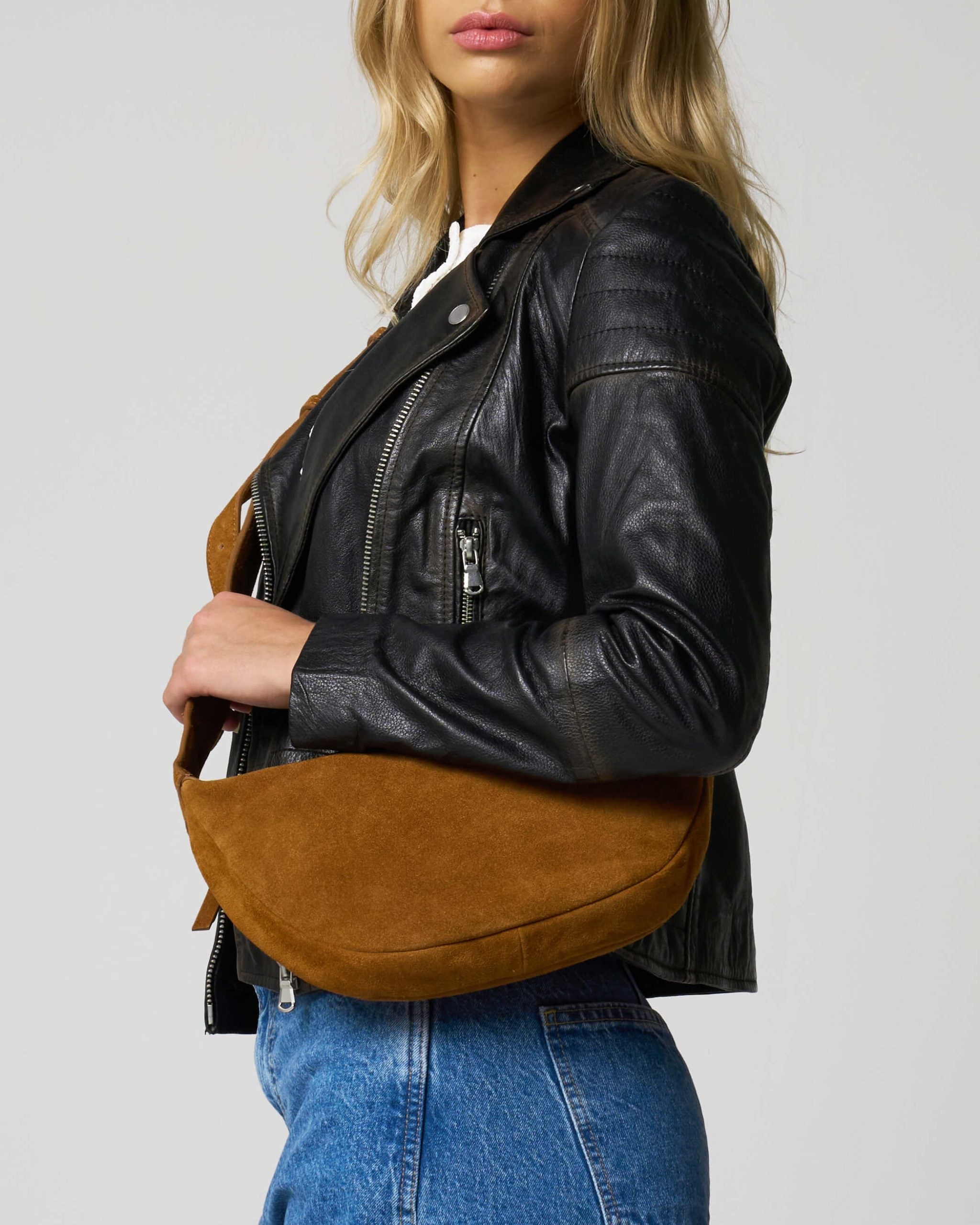 Size on image of the tan suede bag from Barneys Originals. This detail shot shows the texture of real suede up close.