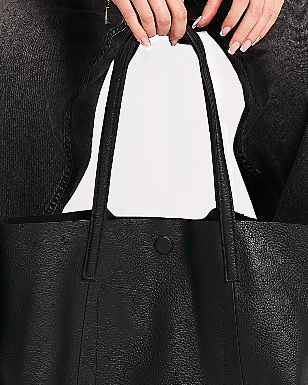 Close up detail of straps on Barneys Originals real leather tote bag.